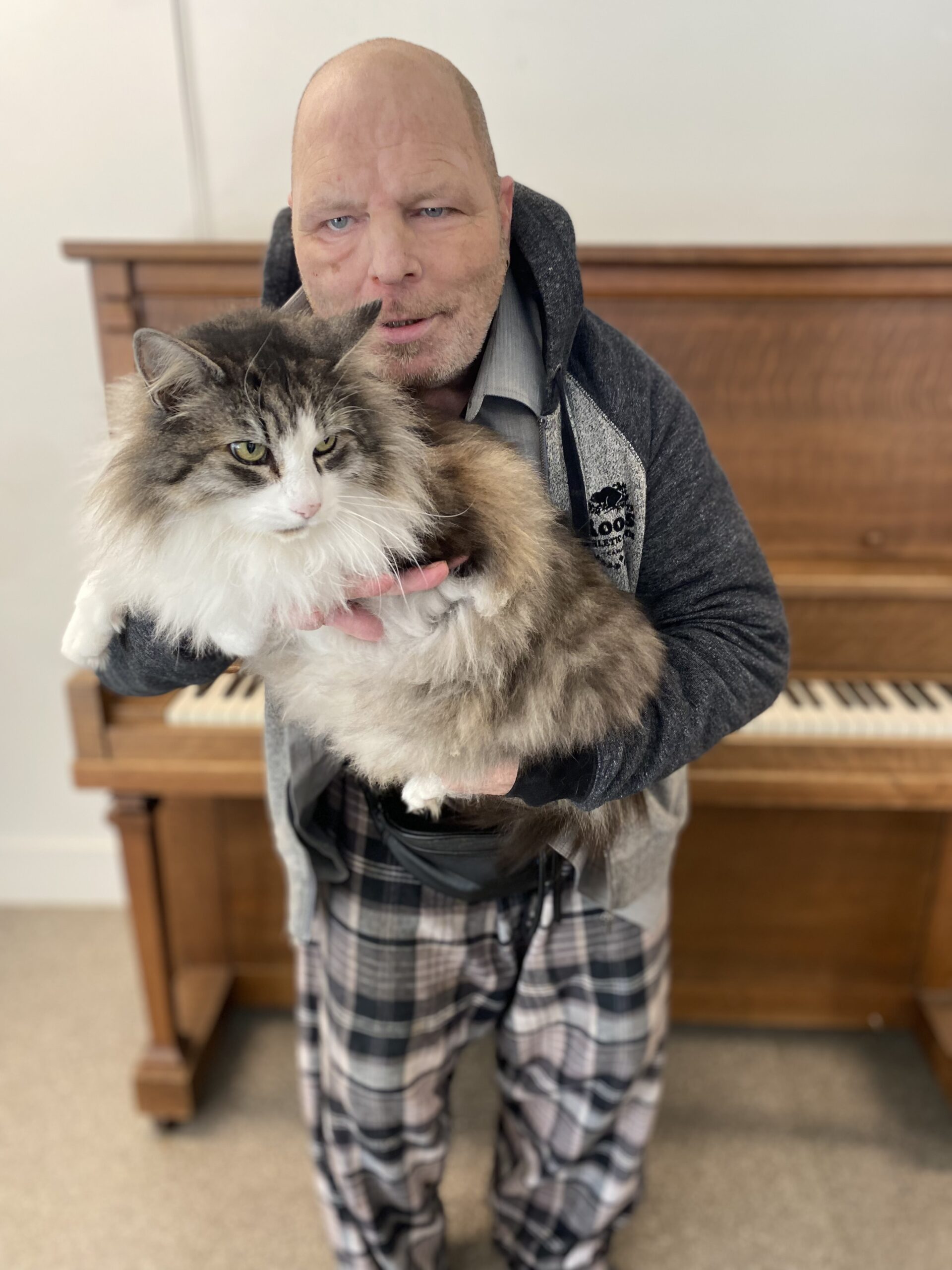 John holding his cat.